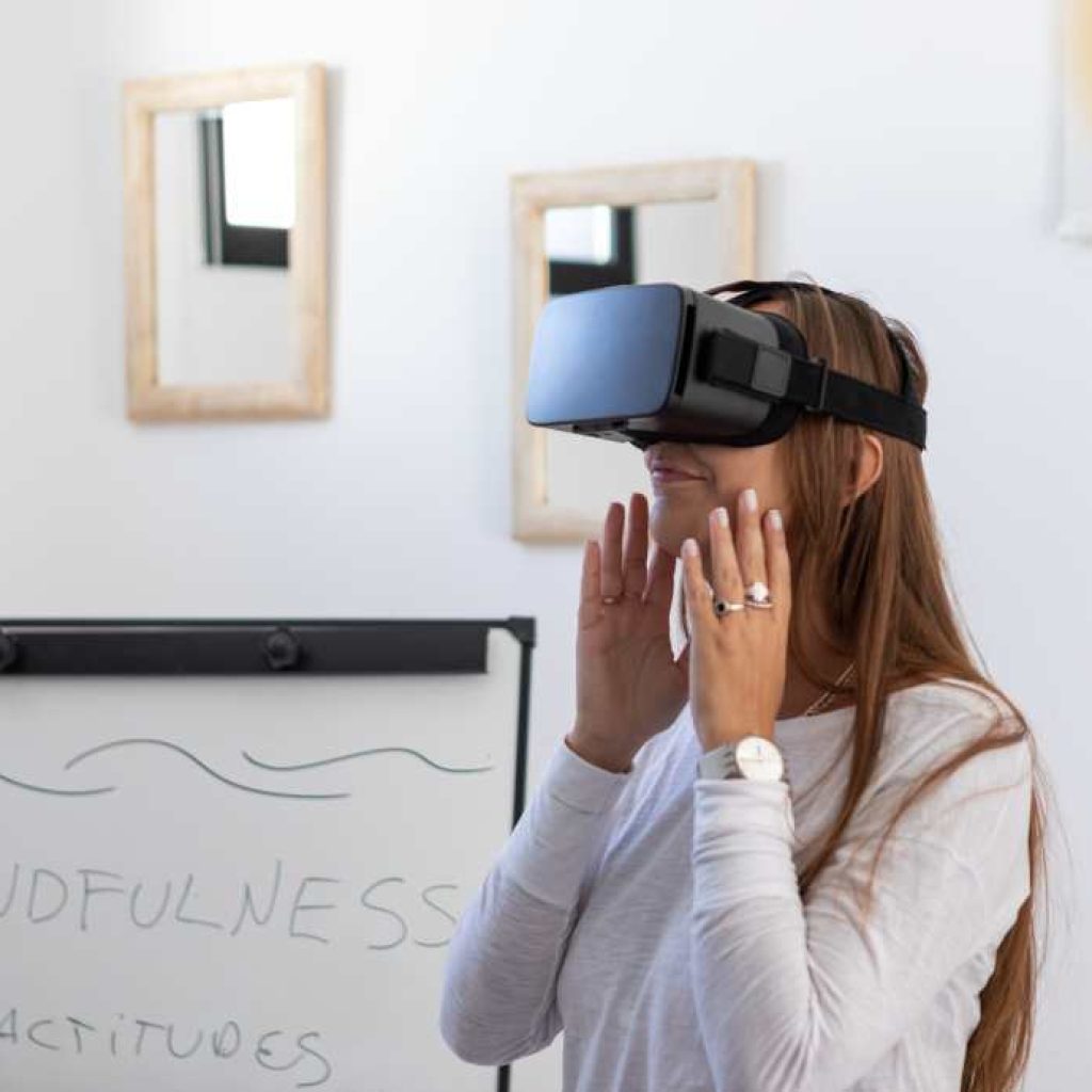 Girl wearing virtual reality headset over her eyes