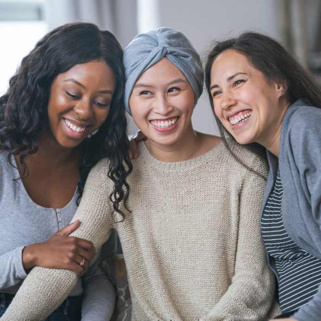 3 women smiling together