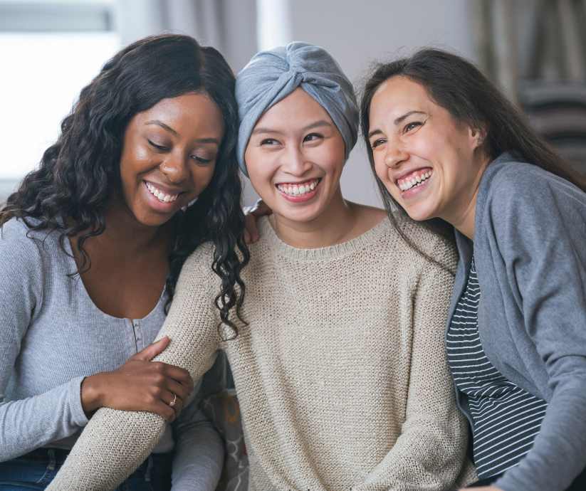 3 women smiling together