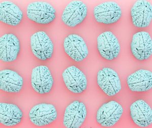 blue brain images multiple on a pink background